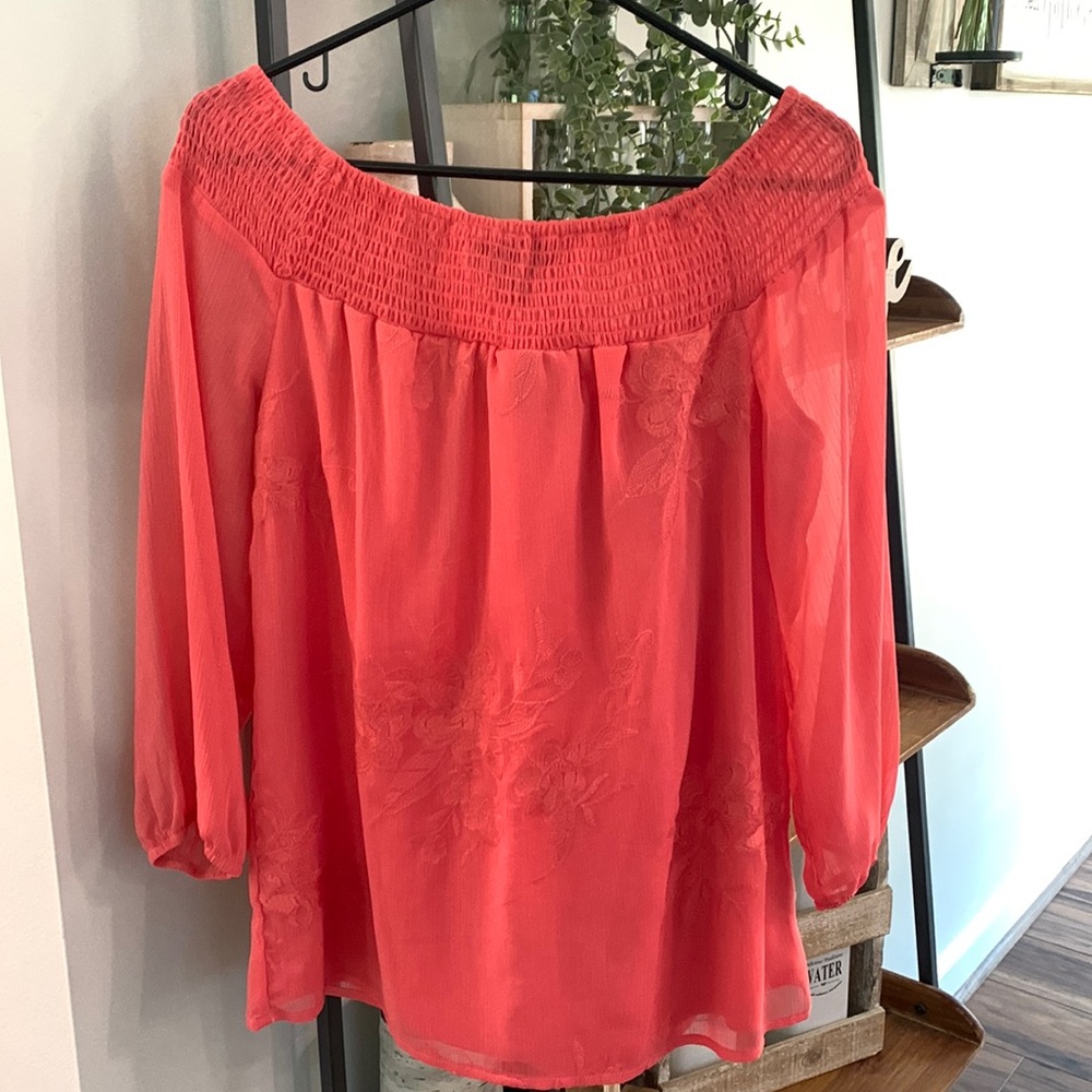 Beautiful peachy pink blouse .